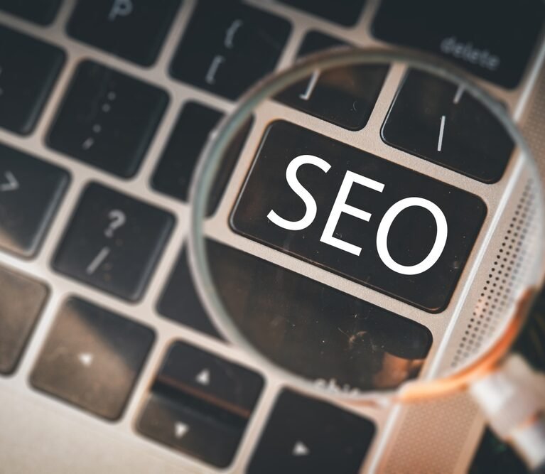 Magnifying,Glass,Focusing,On,An,Seo,Button,On,A,Modern